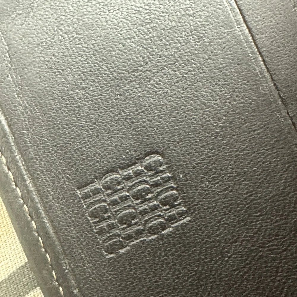 Carolina Herrera bifold canvas and brown leather bi fold wallet